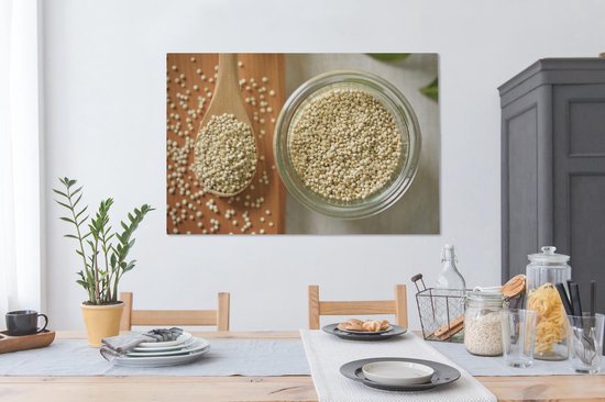 Canvas schilderij 120x80 cm - Wanddecoratie Quinoa in een glazen kom en op een houten lepel - Muurdecoratie woonkamer - Slaapkamer decoratie - Kamer accessoires - Schilderijen op canvas
