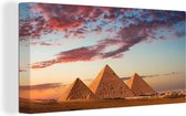 Canvas Schilderij Piramiden van Gizeh in Egypte tijdens zonsondergang - 80x40 cm - Wanddecoratie