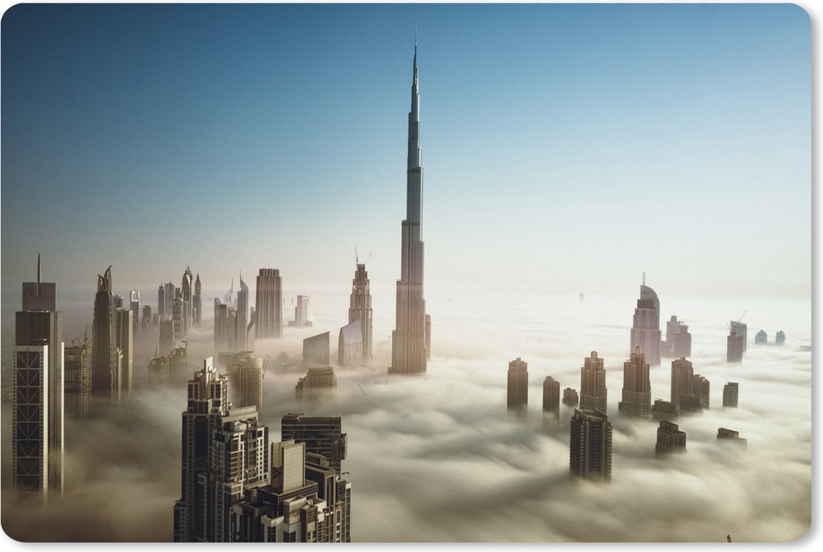 Muismat XXL 120x80 cm - Bureau onderlegger - Bureau mat Prachtig wolkengordijn onder de hoge wolkenkrabber Burj Khalifa - Bureaumat - Gaming mousepad xl - Bureaulegger groot - Computer deskmat
