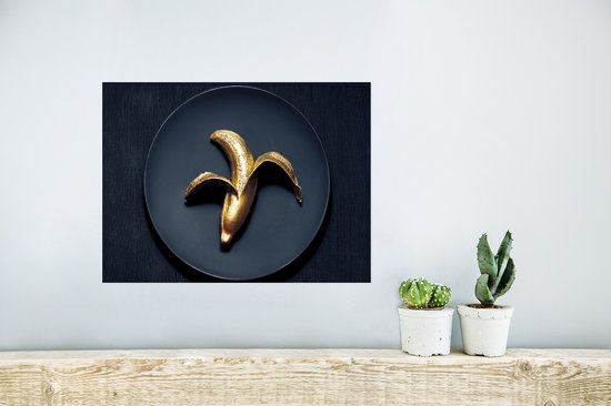 Poster Gouden banaan op een donkere achtergrond - 40x30 cm