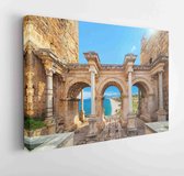 Welcome to the magnificent Antalya concept. a collage of famous landmarks: Hadrian's Gate of the Old City Old City district and Lara beach in Antalya, Turkey popular resort - Moder