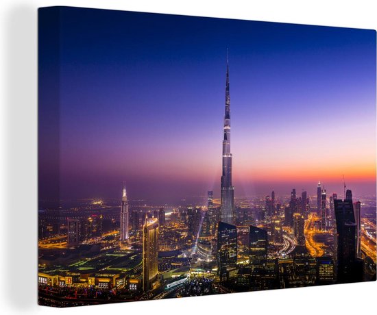 Canvas schilderij 140x90 cm - Wanddecoratie Een zeer bijzondere lucht bij avondschemering boven de Burj Khalifa van Dubai - Muurdecoratie woonkamer - Slaapkamer decoratie - Kamer accessoires - Schilderijen