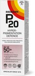 Doosje Riemann P20 Hyperpigmentation Defence SPF 50+ met oranje, gele en rode cirkels. Beschrijft voordelen zoals 10 uur bescherming en formule met niacinamide.