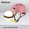 Roze fietshelm met kinbeschermer. De kinbeschermer is ingezoomd en van bruin, zacht materiaal.