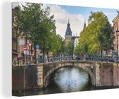 Canvas schilderij 140x90 cm - Wanddecoratie Brug over de Prinsengracht in Amsterdam - Muurdecoratie woonkamer - Slaapkamer decoratie - Kamer accessoires - Schilderijen