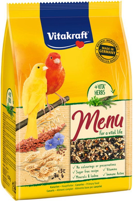 Gele en rode kanarie op gele zak met Vitakraft Menu voor een vitaal leven, +VITA HERBS en ingrediënten.