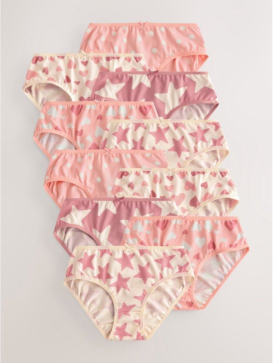 Tien roze slips met verschillende patronen: stippen, harten, wolken en sterren.