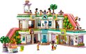 Centre commercial LEGO Friends avec mini-poupées, chariot à glaces, toboggans et plantes. Le bâtiment a plusieurs étages.