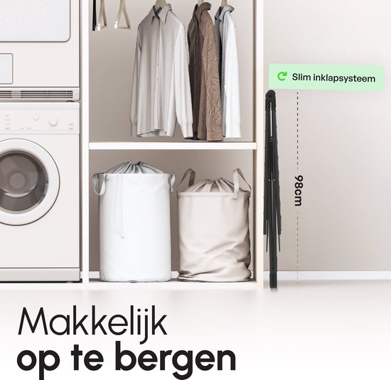 Een zwart, ingeklapt droogrek naast een wasmachine en droger. Tekst: 'Makkelijk op te bergen', '98cm' en 'Slim inklapsysteem'.