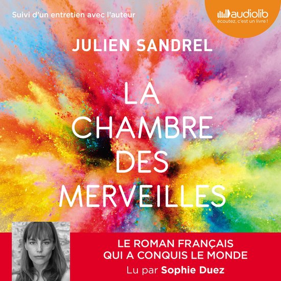 Boekomslag met een explosie van kleurrijke verf, titel 'La Chambre des Merveilles' van Julien Sandrel, met een foto van de auteur.