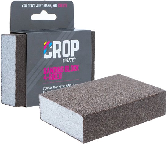 Bruin schuurblok met grijze schuimrubber onderkant, naast verpakking met tekst 'CROP CREATE SANDING BLOCK 4-SIDED'.