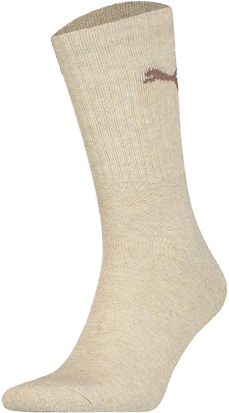 Een beige Puma sok met PUMA logo en ribbelpatroon.
