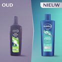 Vergelijking van oude en nieuwe Andrélon Men shampoo. De oude fles is donkergrijs, de nieuwe is blauw met een groen-witte opdruk.