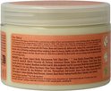 Ingrediënten en "Our Story" op de achterkant van de pot Shea Moisture Coconut & Hibiscus Curl Enhancing Smoothie.