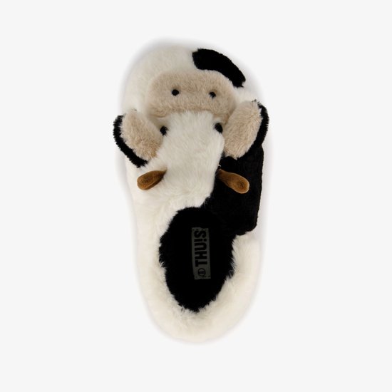 Witte pantoffel met zwarte vlekken en een koeiengezicht met bruine hoorns.