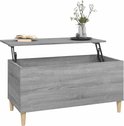 Grijze salontafel met houtnerf, opklapbaar blad, op houten pootjes, met decoratie.