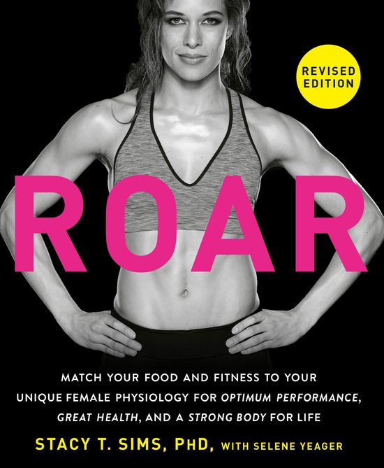 Boek "ROAR", herziene editie met een gespierde vrouw in sportkleding op de voorkant. "REVISED EDITION" in geel.