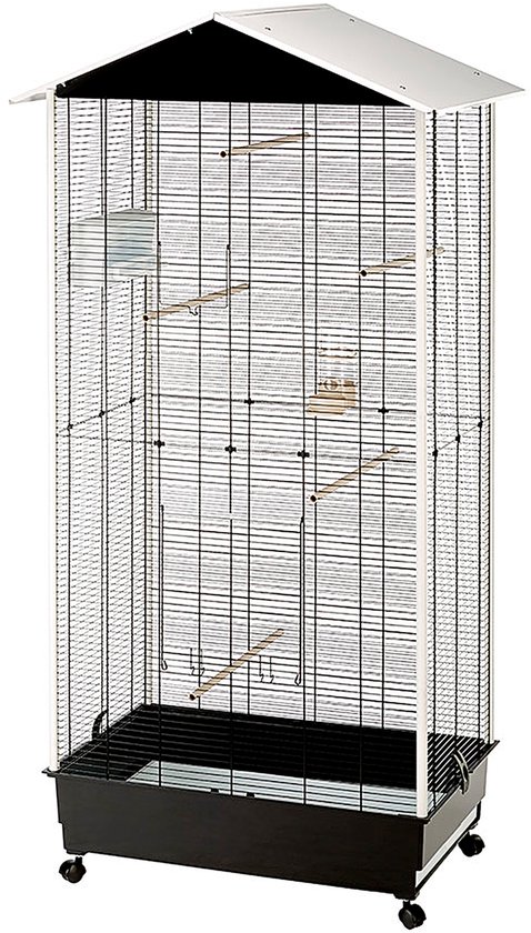 Une haute cage à oiseaux noire avec des accents blancs et un toit pointu. La cage est sur roulettes et possède un plateau.