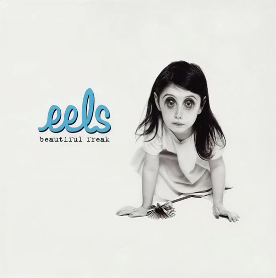 Albumhoes Eels - Beautiful Freak met een zwart-wit foto van een kind en het blauwe logo.