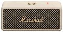 Crème Marshall speaker met gouden raster en logo.