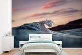 Behang - Fotobehang Kalme golven bij zonsondergang - Breedte 330 cm x hoogte 220 cm