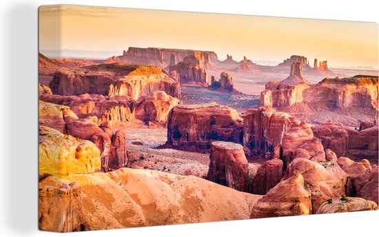 Canvas Schilderij Panorama van de Monument Valley in Amerika - Wanddecoratie
