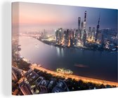 Canvas Schilderij Shanghai - Zonsondergang - Skyline - 90x60 cm - Wanddecoratie