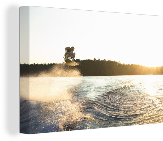 Sous le coucher du soleil un wakeboarder fait une énorme toile de saut 60x40 cm - Tirage photo sur toile (Décoration murale salon / chambre)