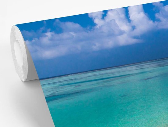 Papier peint Papier peint photo en vinyle - Vue depuis la plage tropicale sur l'eau bleu azur largeur 600 cm x hauteur 400 cm - Tirage photo sur papier peint (disponible en 7 tailles) / Mer et plage