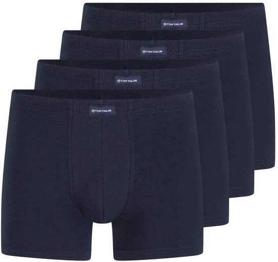 Vier donkerblauwe boxershorts van katoen, naast elkaar geplaatst.