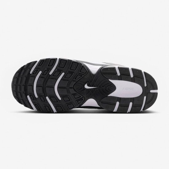 Nike kinder sneaker, witte en grijze zool met zwart profiel en witte Nike-logo.