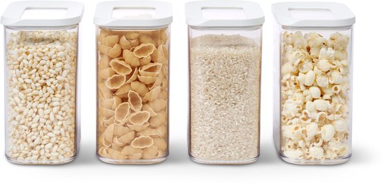 Quatre boîtes de conservation Mepal Modula, 1500 ml chacune, remplies de riz soufflé, pâtes coquillettes, riz et pop-corn.