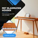 Digitale piano met houten afwerking en bladmuziekhouder, ook geschikt voor tablet. Stabiele standaard.