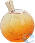 Elixir des Merveilles Eau de Parfum. Rond parfumflesje met goudkleurige dop, oranje-geel glas met gouden spikkels.