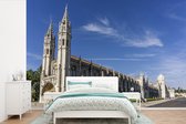 Behang - Fotobehang Het Mosteiro dos Jerónimos in Lissabon - Breedte 600 cm x hoogte 400 cm