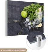 MuchoWow® Glasschilderij 80x60 cm - Schilderij acrylglas - Cocktail - Mojito - Ijsblokjes - Foto op glas - Schilderijen