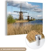 MuchoWow® Glasschilderij 80x60 cm - Schilderij acrylglas - Rij molens in Kinderdijk - Foto op glas - Schilderijen