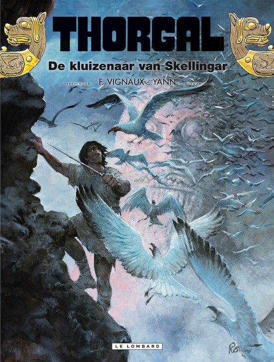Thorgal 37 - De kluizenaar van Skellingar. Thorgal klimt langs een rotswand, omringd door meeuwen, onder een dramatische hemel.