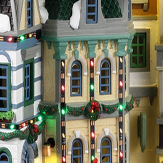 Un Paysage Urbain Avec De Nombreux Bâtiments éclairés Dans La Nuit