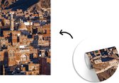 Behang - Fotobehang Cityscape oude stad Sanaa met de Jemenitische zon - Breedte 175 cm x hoogte 260 cm