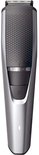 Zilveren Philips baardtrimmer met zwarte grip, zoomwiel en aan/uit-knop.