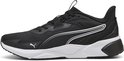 Zwarte Puma sportschoen met witte zool, zilveren strepen op de zijkant en Puma-logo.