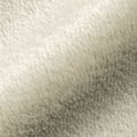 Close-up van de zachte textuur van een beige fleecemateriaal.