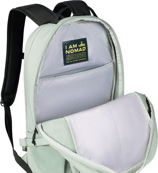 Open lichtgroene rugzak met binnenvakken en een 'I AM NOMAD' label.