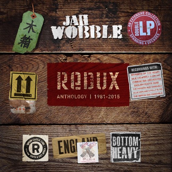 Albumhoes met houten achtergrond en stickers, waaronder 'RODUX ANTHOLOGY | 1981-2015'.