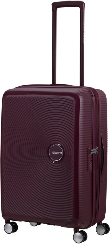 Bordeauxrode American Tourister spinner koffer met cirkelvormig patroon, uitschuifbare handgreep en TSA-slot.