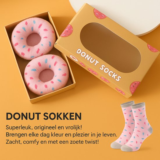 Roze sokken met donutprint en roze & blauwe spikkels. De sokken hebben een grijze boord en zijn opgerold als donuts.