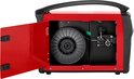 Rood Stamos lasapparaat met open deur, zicht op een rol lasdraad en de draadaanvoer mechanisme.