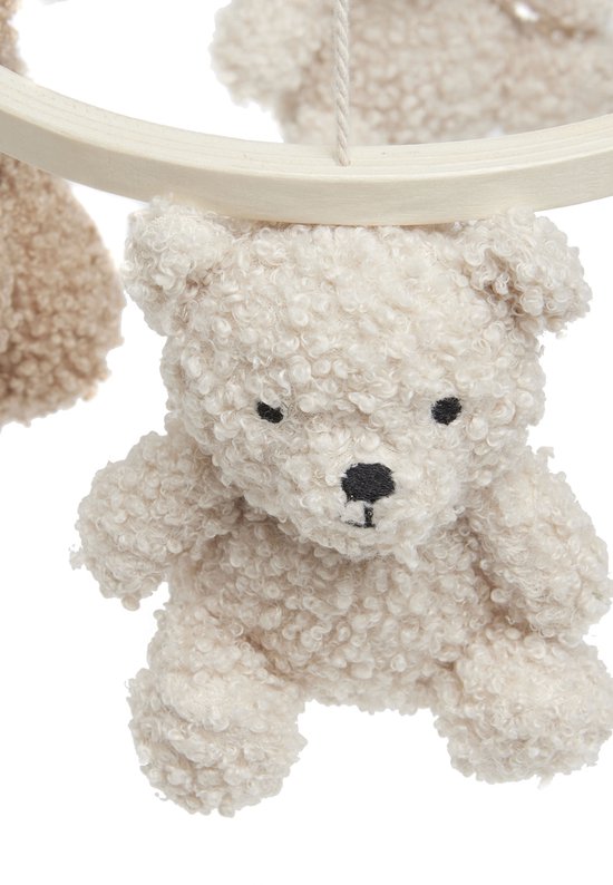 Lichtbeige teddybeer mobiel met schattig gezicht en krullend bont.