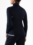 Donkerblauw trainingsjack voor dames met witte bies langs de rits en zoom. Merk: Sjeng Sports.